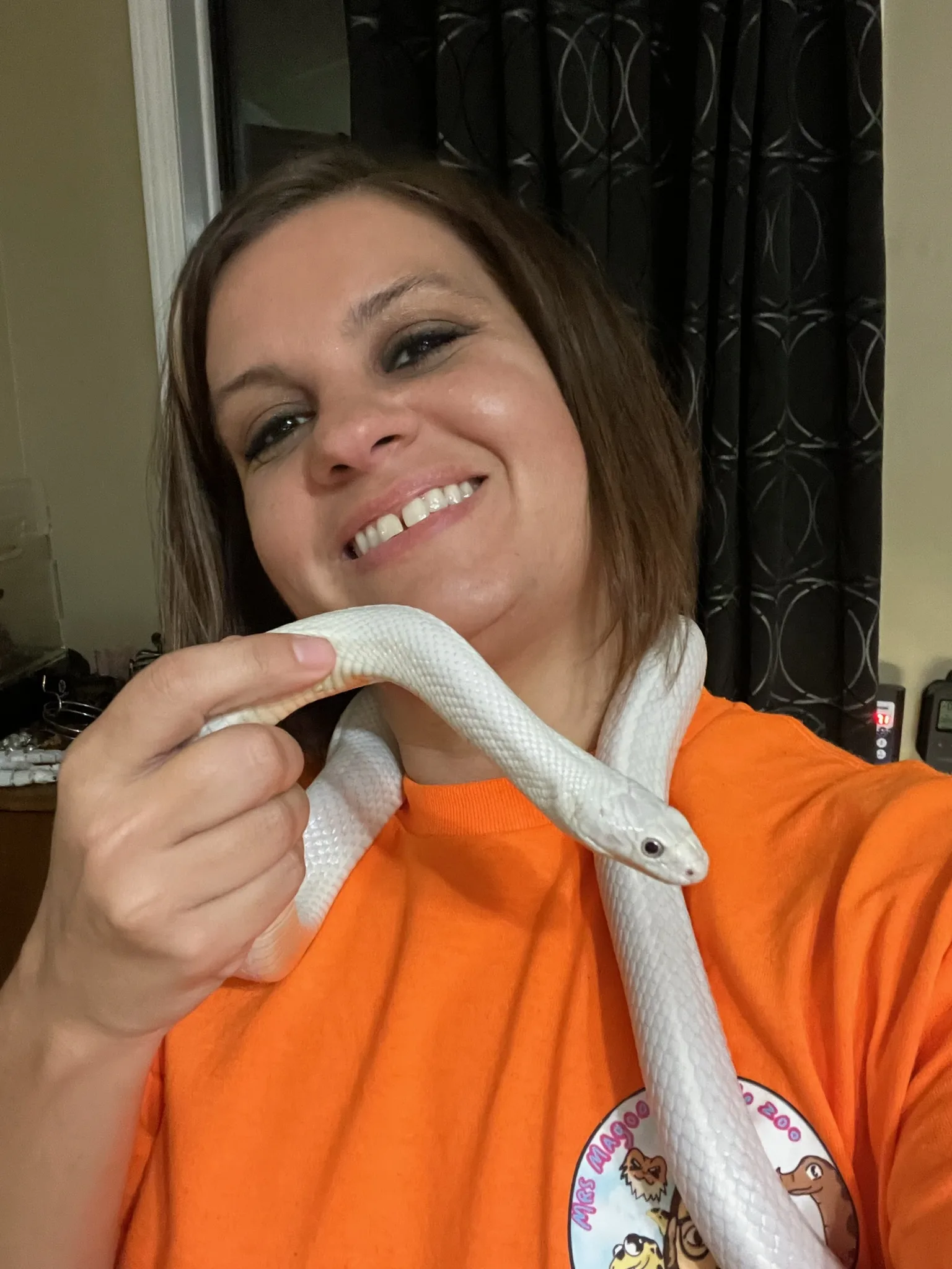 Crystal with reptiles at a Reptile Adventures Alabama event
